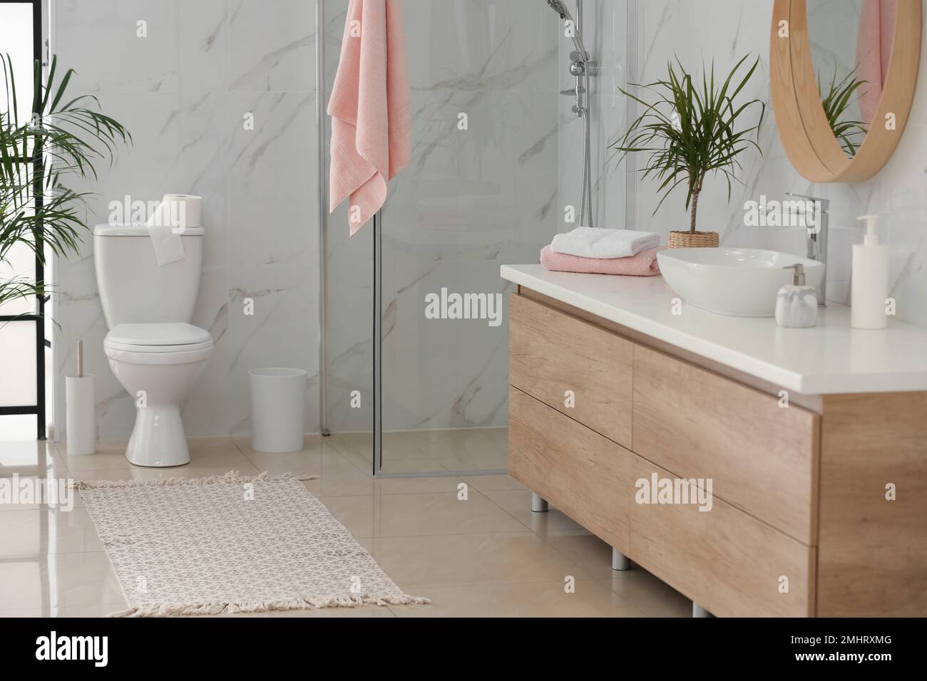Interior of modern bathroom with toilet bowl Stock Photo - Alamy