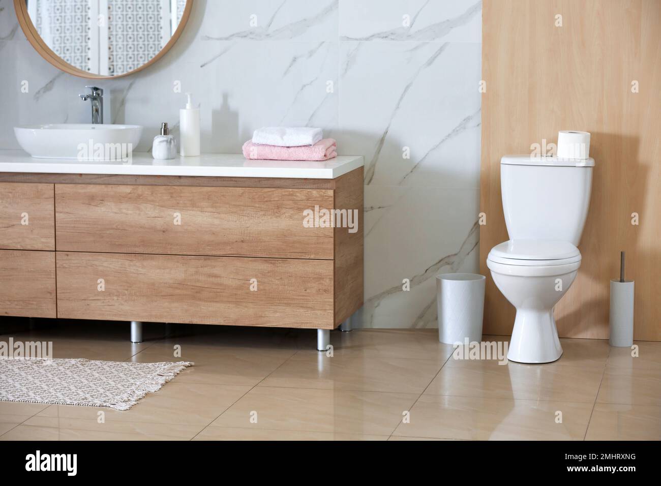Interior of modern bathroom with toilet bowl Stock Photo - Alamy