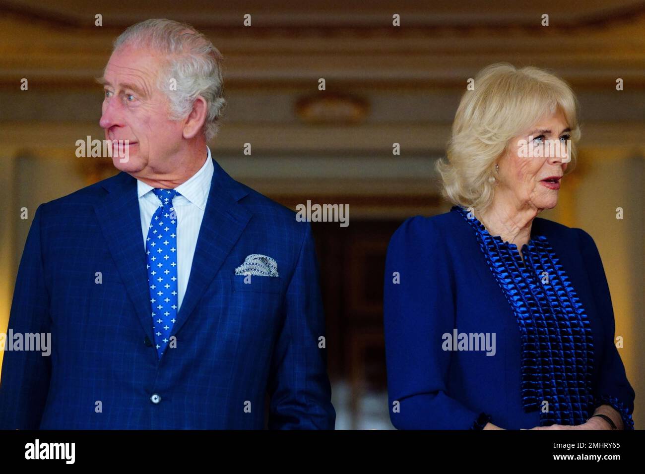 King Charles III and the Queen Consort talk with genocide survivors after lighting two candles to mark Holocaust Memorial Day at Buckingham Palace, London. Picture date: Friday January 27, 2023. Stock Photo
