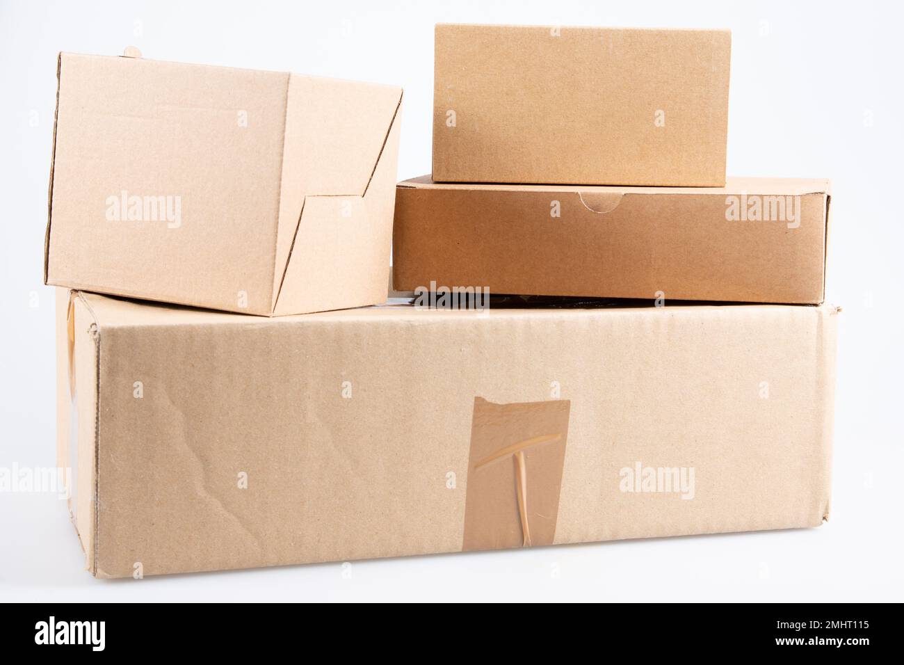 used cardboard boxes on white background Stock Photo Alamy