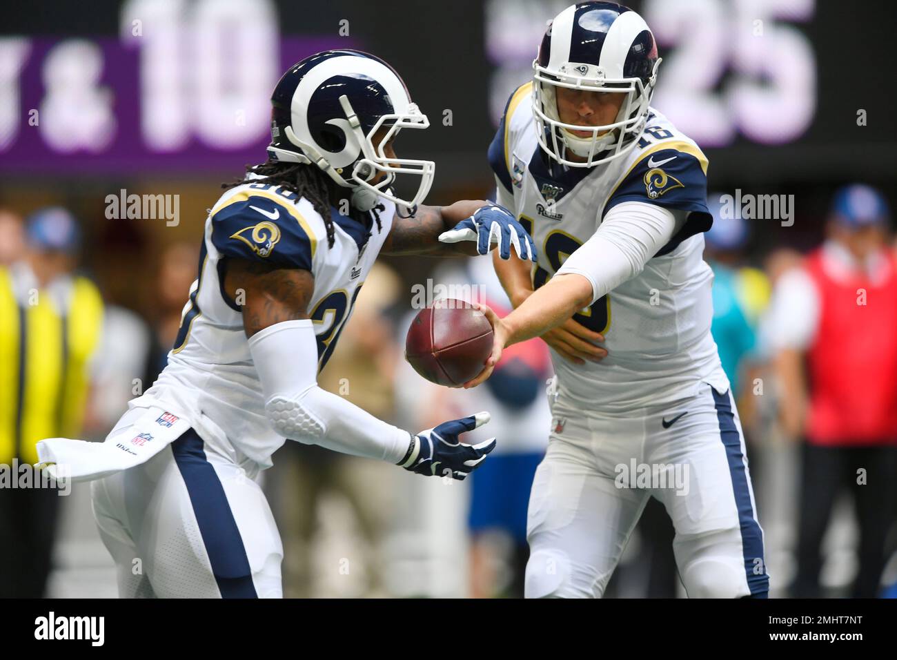 In this Sunday, Oct. 8, 2017, file photo, Los Angeles Rams quarterback  Jared Goff (16) hands the ball to Todd Gurley (30) during an NFL football  game against the Seattle Seahawks, in