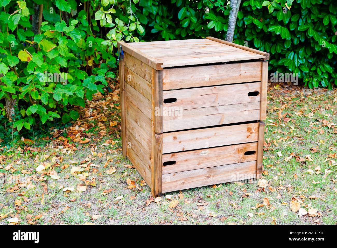 wooden new garden compost bin of organic material composter Stock Photo