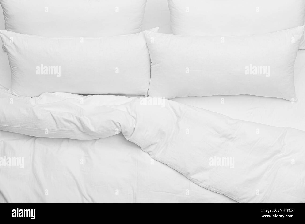 Soft white pillows and blanket on bed, top view Stock Photo Alamy