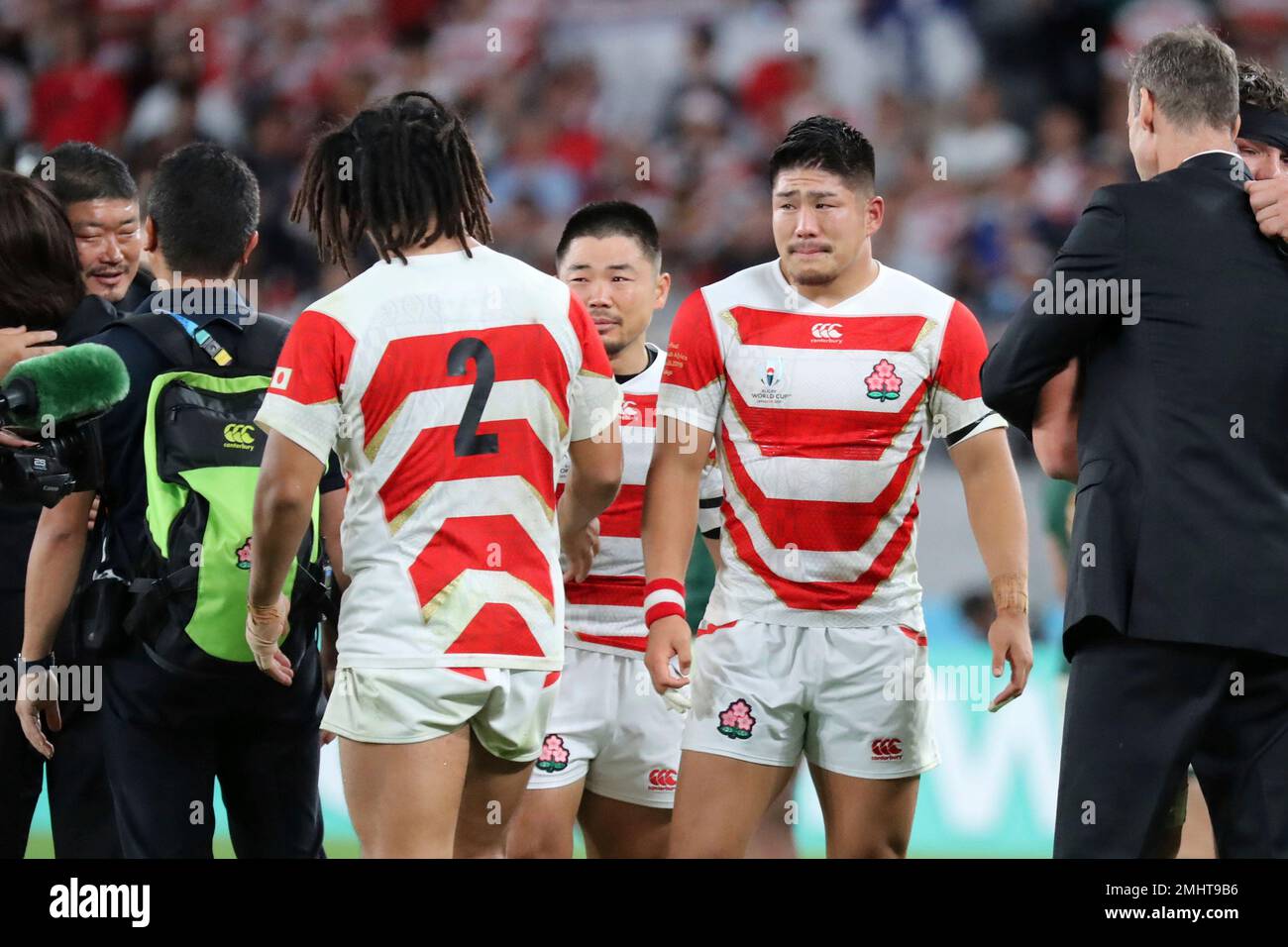 Japan's Rikiya Matsuda, right, and Fumiaki Tanaka, center, react after ...
