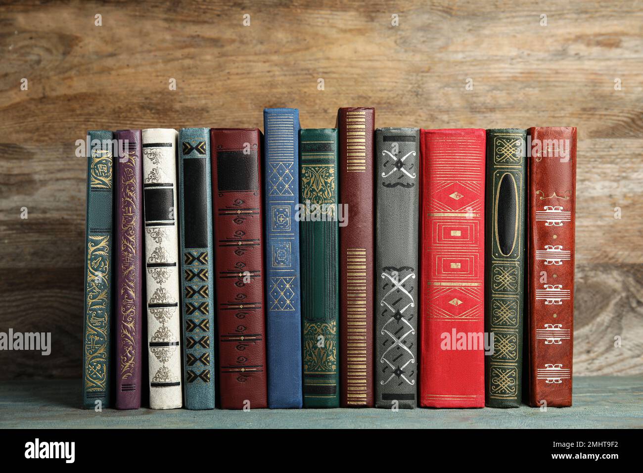 Collection of old books on wooden shelf Stock Photo - Alamy
