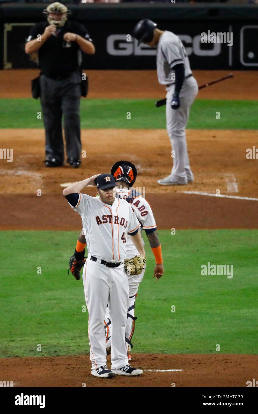 Houston Astros catcher Martin Maldonado talks with starting pitcher Brad Peacock on the mound during the second inning in Game 6 of baseballs American League Championship Series against the New York Yankees