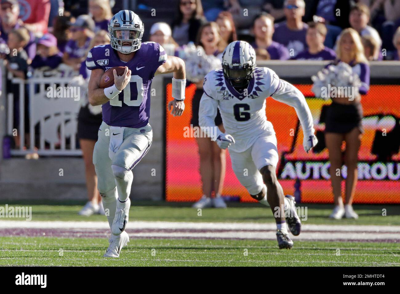 Kansas State quarterback Skylar Thompson (10) is chased by TCU safety Innis  Gaines (6) as he runs for a first down during the second half of an NCAA  college football game Saturday