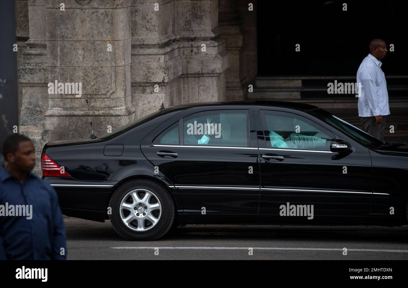 Cuba's President Miguel Diaz-Canel waves from the back of his car after ...