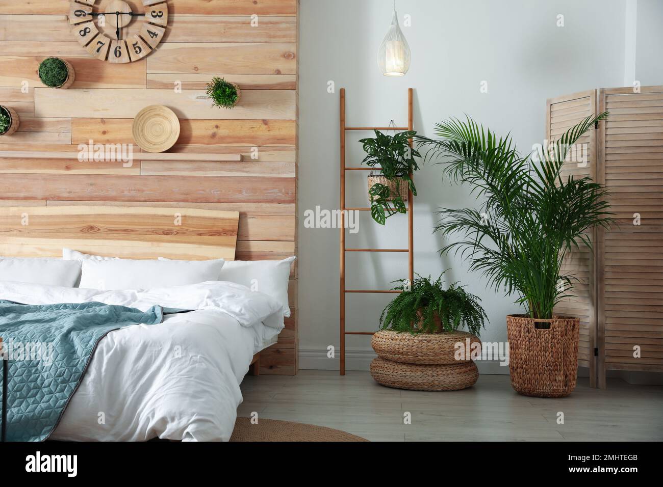 Stylish bedroom interior with green plants. Home design ideas Stock ...