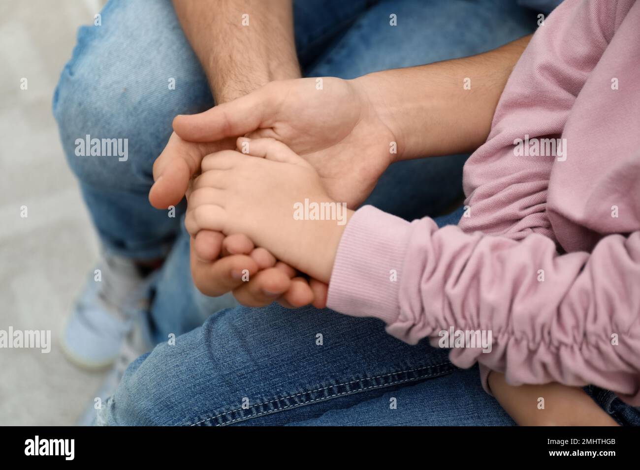 Closeup view of happy family holding hands Stock Photo - Alamy
