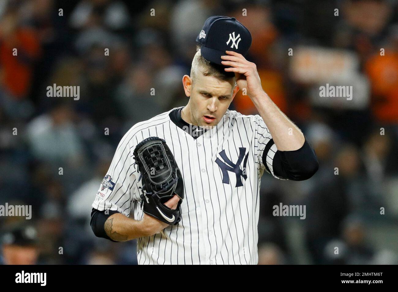New York Yankees starting pitcher James Paxton reacts after walking