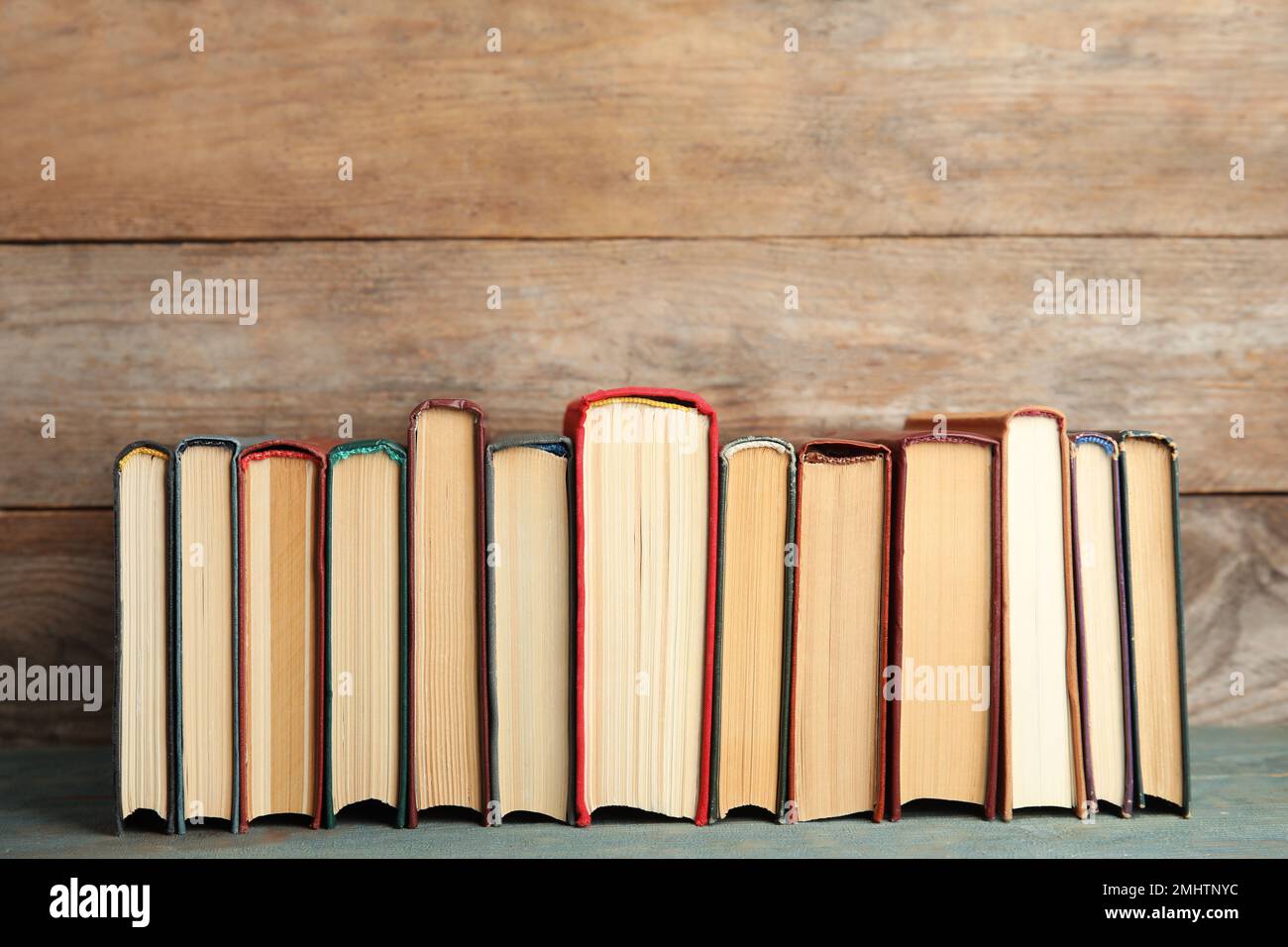 Collection of old books on wooden shelf Stock Photo - Alamy