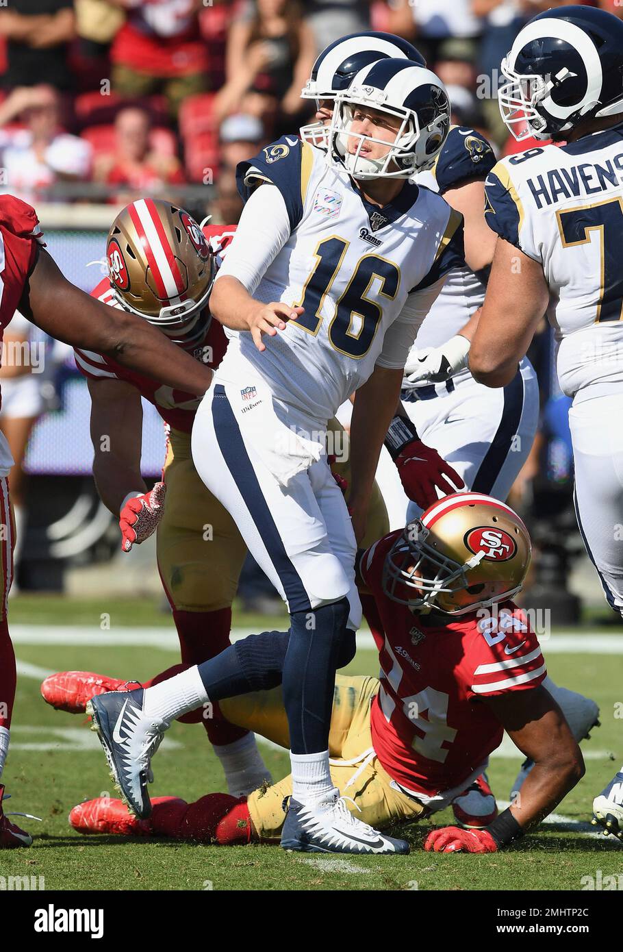 Los Angeles Rams quarterback Jared Goff (16) off balance after being hit  while passing the ball during an NFL football game against the San  Francisco 49ers, Sunday, October 13, 2019 in Los