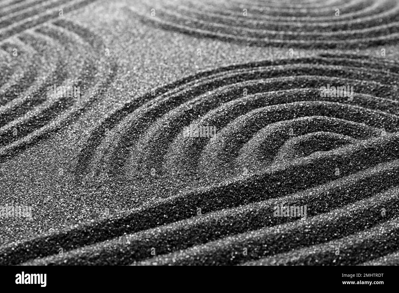 Pattern on decorative black sand, closeup. Zen and harmony Stock Photo ...
