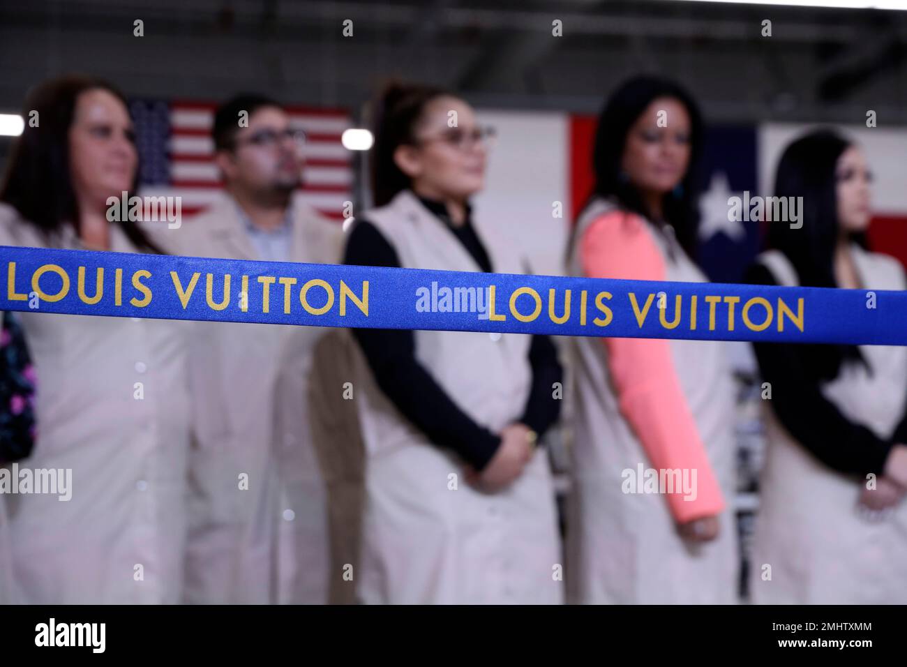 Workers watch before President Donald Trump participates in a ribbon  cutting ceremony at the Louis Vuitton Workshop Rochambeau in Alvarado, Texas,  Thursday, Oct. 17, 2019. (AP Photo/Andrew Harnik Stock Photo - Alamy