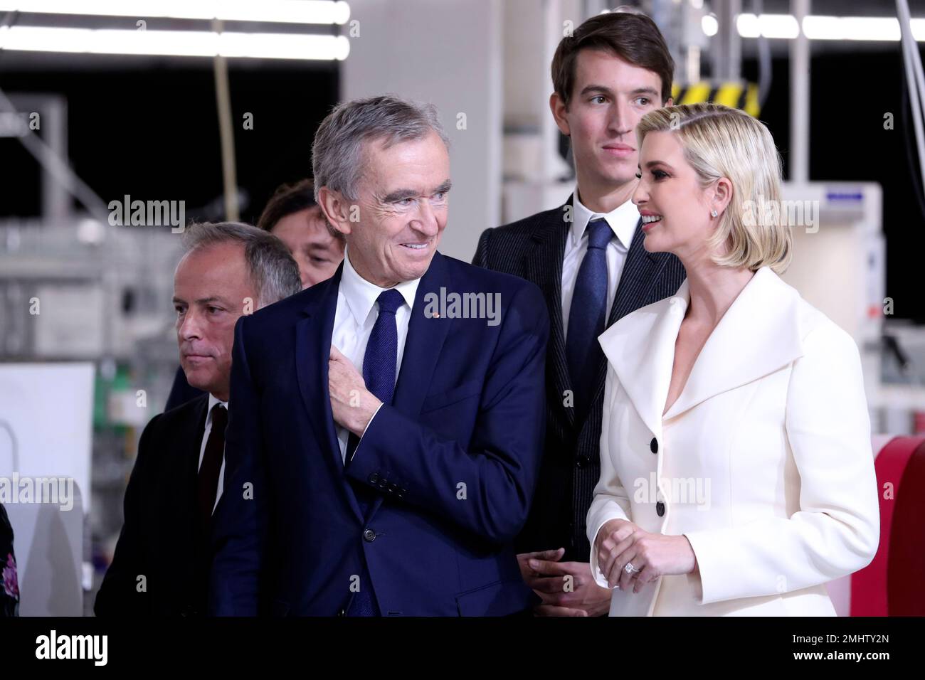 Bernard Arnault, chief executive of LVMH, second from left, Alexandre  Arnault, second from right and Ivanka Trump talk as President Donald Trump  tours the Louis Vuitton Workshop Rochambeau in Alvarado, Texas, Thursday