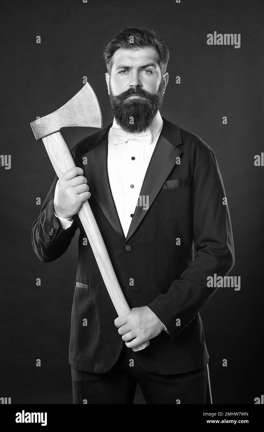 Everyone loves a fresh haircut. Bearded guy holding ax. Axe shaving