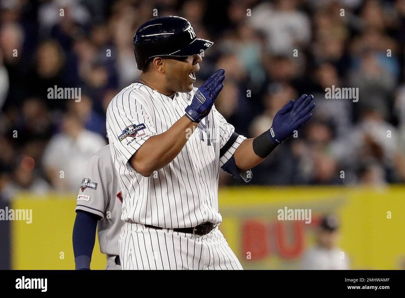 New York Yankees designated hitter Edwin Encarnacion (30) reacts after  hitting a double against the Houston Astros during the fifth inning of Game  3 of baseball's American League Championship Series, Tuesday, Oct.
