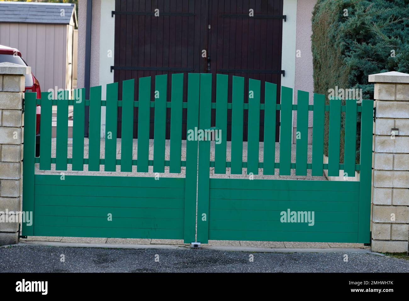 green modern house gate and garage door to access home garden Stock Photo Alamy