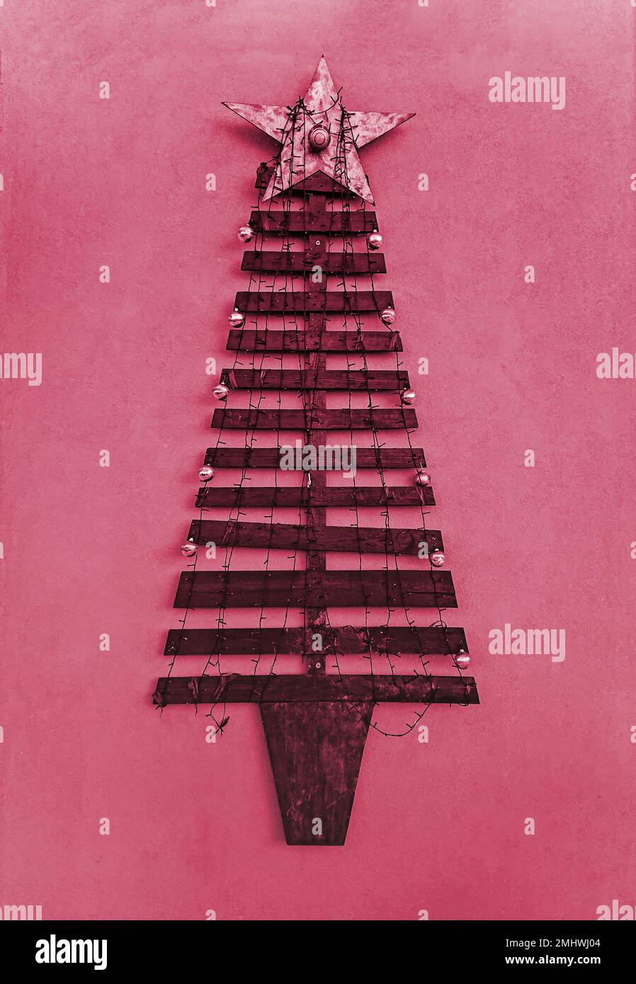 DIY Christmas tree made from planks as outdoor wall decoration. Xmas