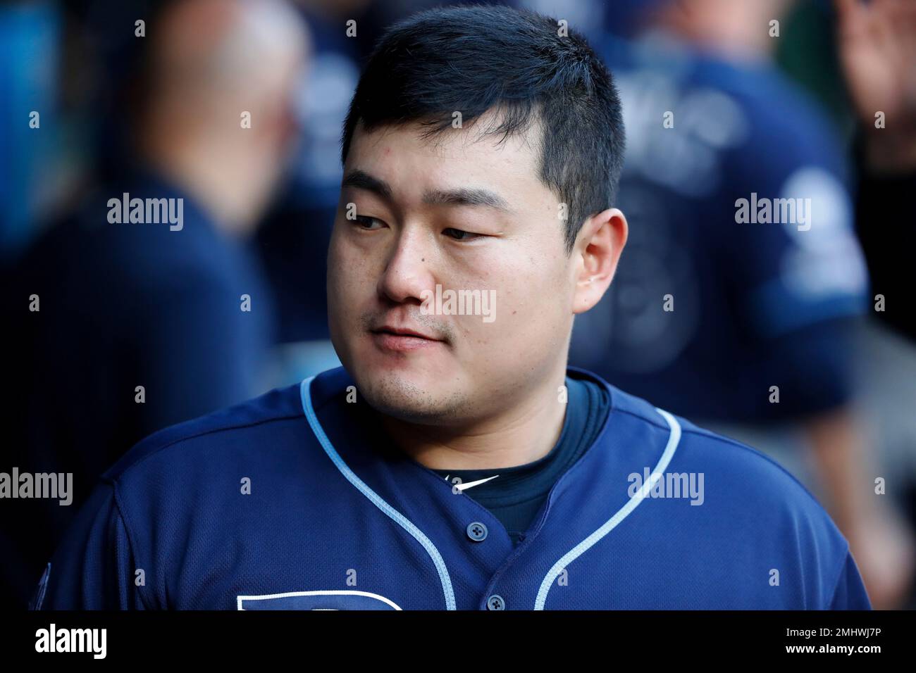 Tampa Bay Rays' JiMan Choi walks through the dugout during a baseball