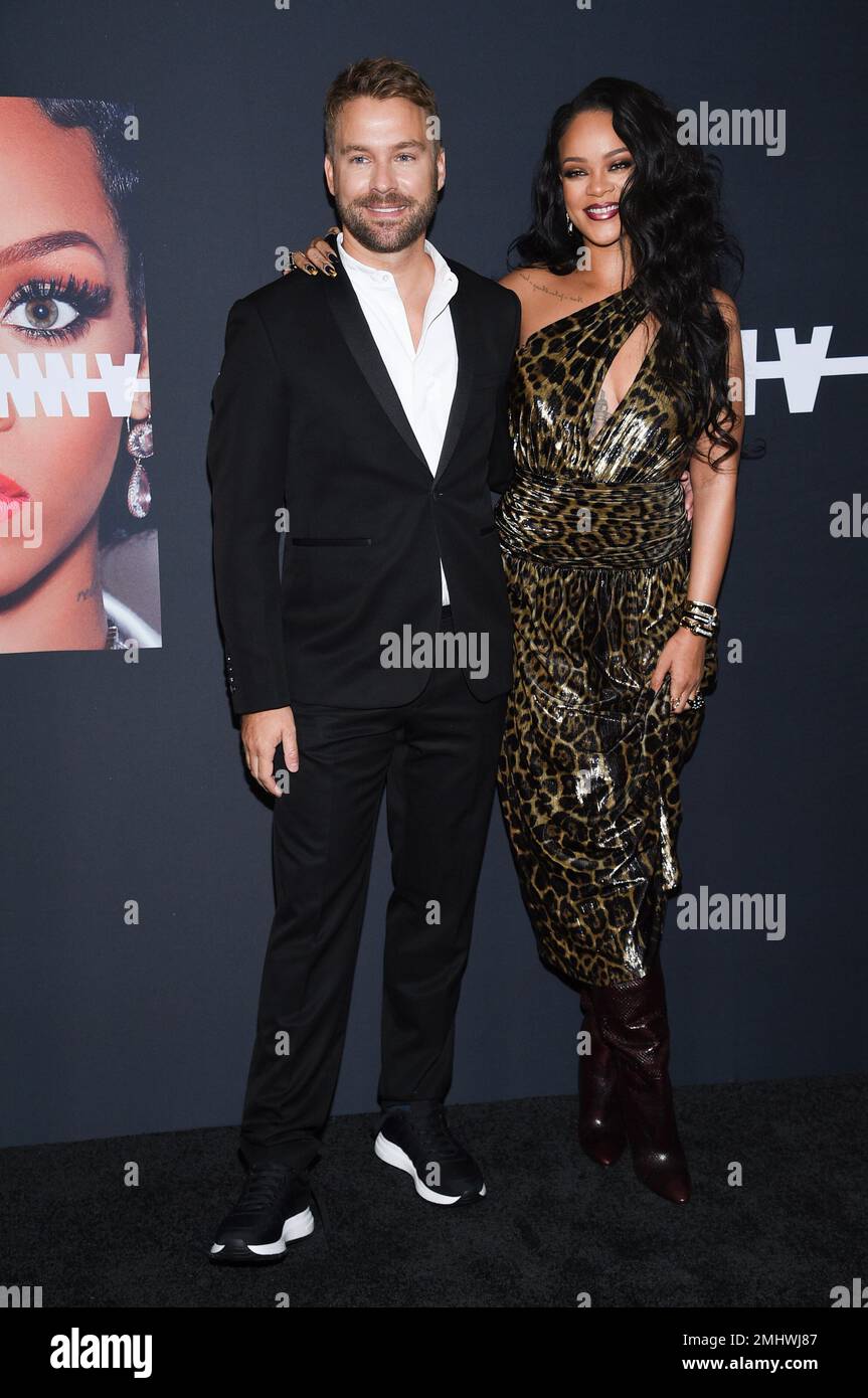 Singer and fashion designer Rihanna, right, and Dennis Leupold attend ...