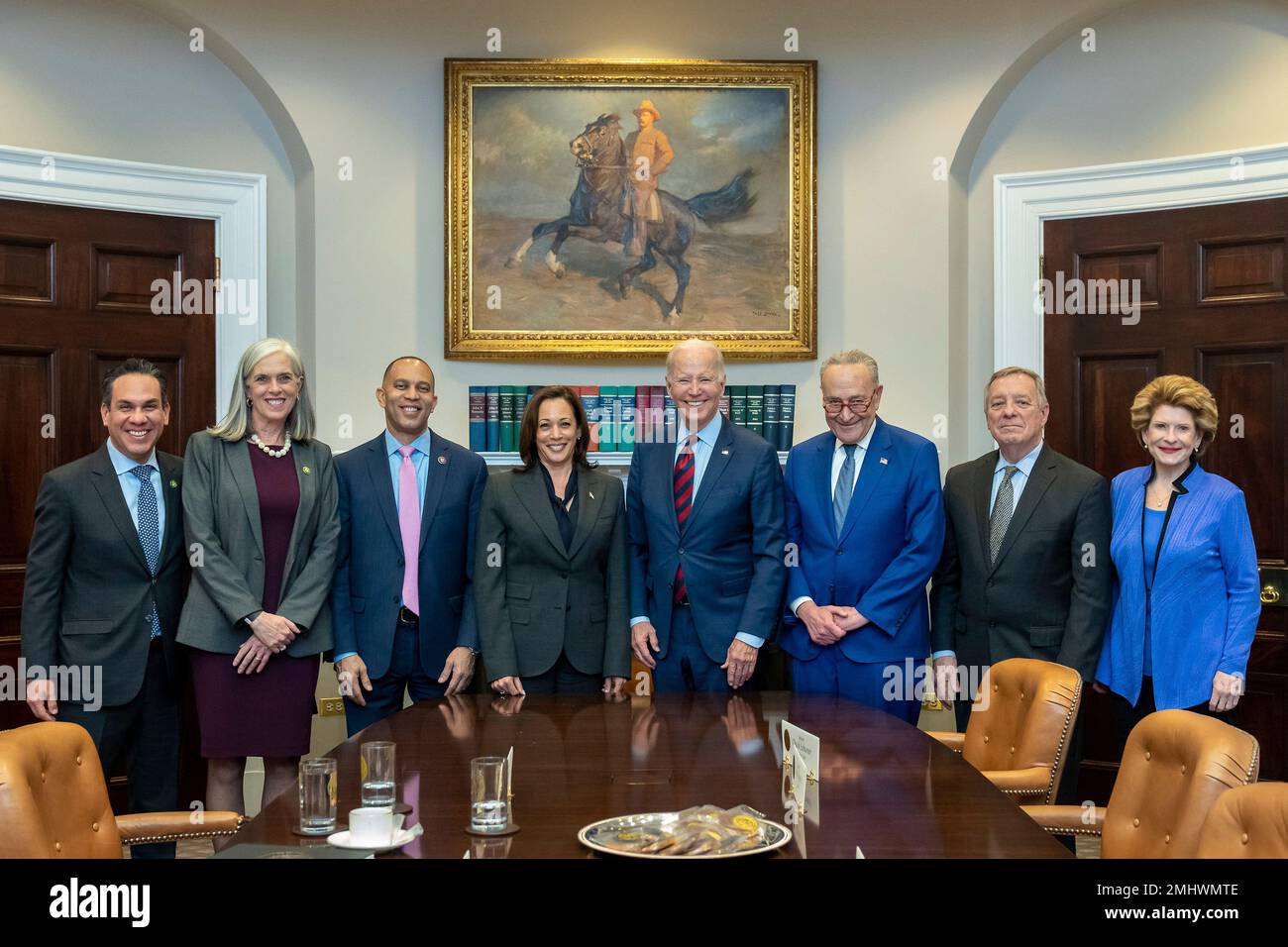 Washington, United States of America. 24 January, 2023. U.S President Joe Biden, center, poses for a group photo with Vice President Kamala Harris, center left, and members of the Democratic Congressional Leadership at the Roosevelt Room of the White House, January 24, 2023 in Washington, D.C. Left to right: Rep. Pete Aguilar, Rep. Katherine Clark, Minority Leader Hakeem Jeffries, Vice President Kamala Harris, President Joe Biden, Majority Leader Chuck Schumer, Sen. Dick Durbin, and Sen. Debbie Stabenow.  Credit: Erin Scott/White House Photo/Alamy Live News Stock Photo