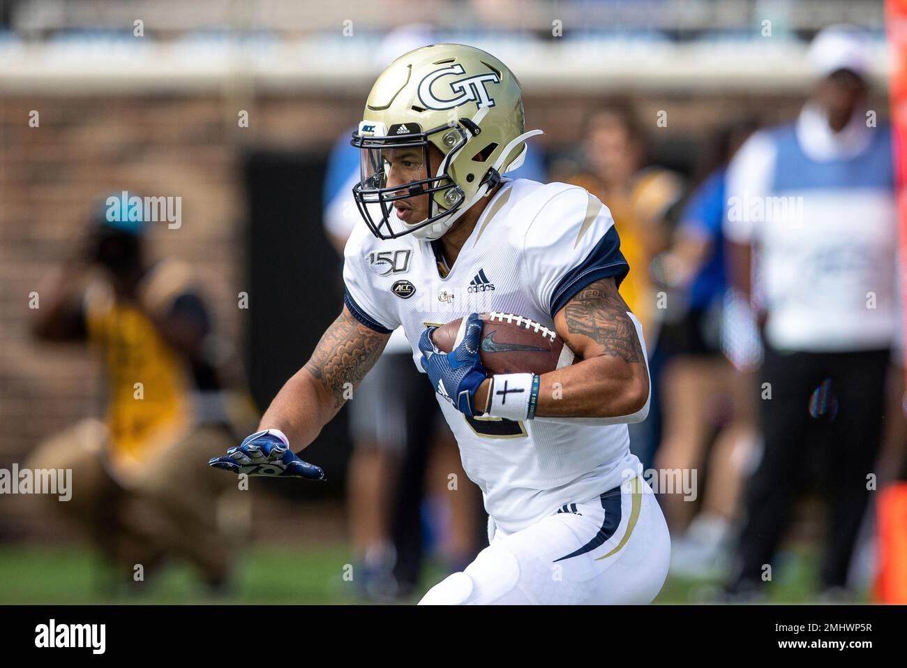 Tech's Tobias Oliver returns a kick during an NCAA college