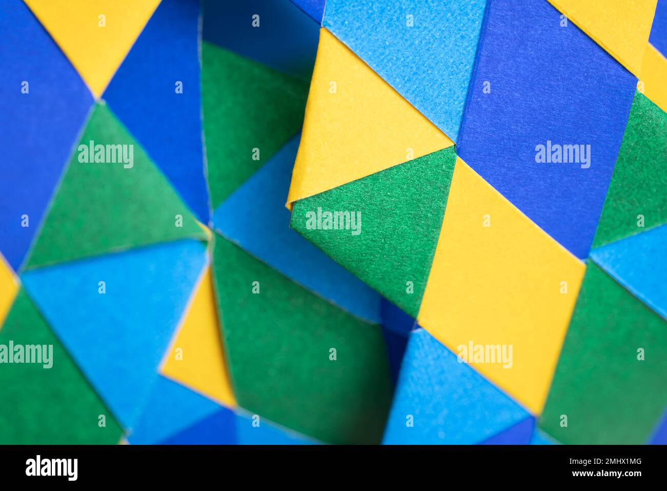 Background abstract geometric design triangle vivid color blue yellow and green weave element wallpaper graphic pattern.Modern fashion style website b Stock Photo