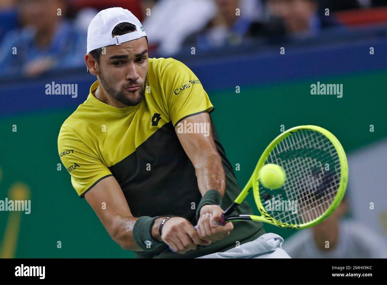 Matteo Berrettini of Italy hits a return shot against Alexander Zverev of  Germany in their men's singles semifinal match at the Shanghai Masters  tennis tournament at Qizhong Forest Sports City Tennis Center