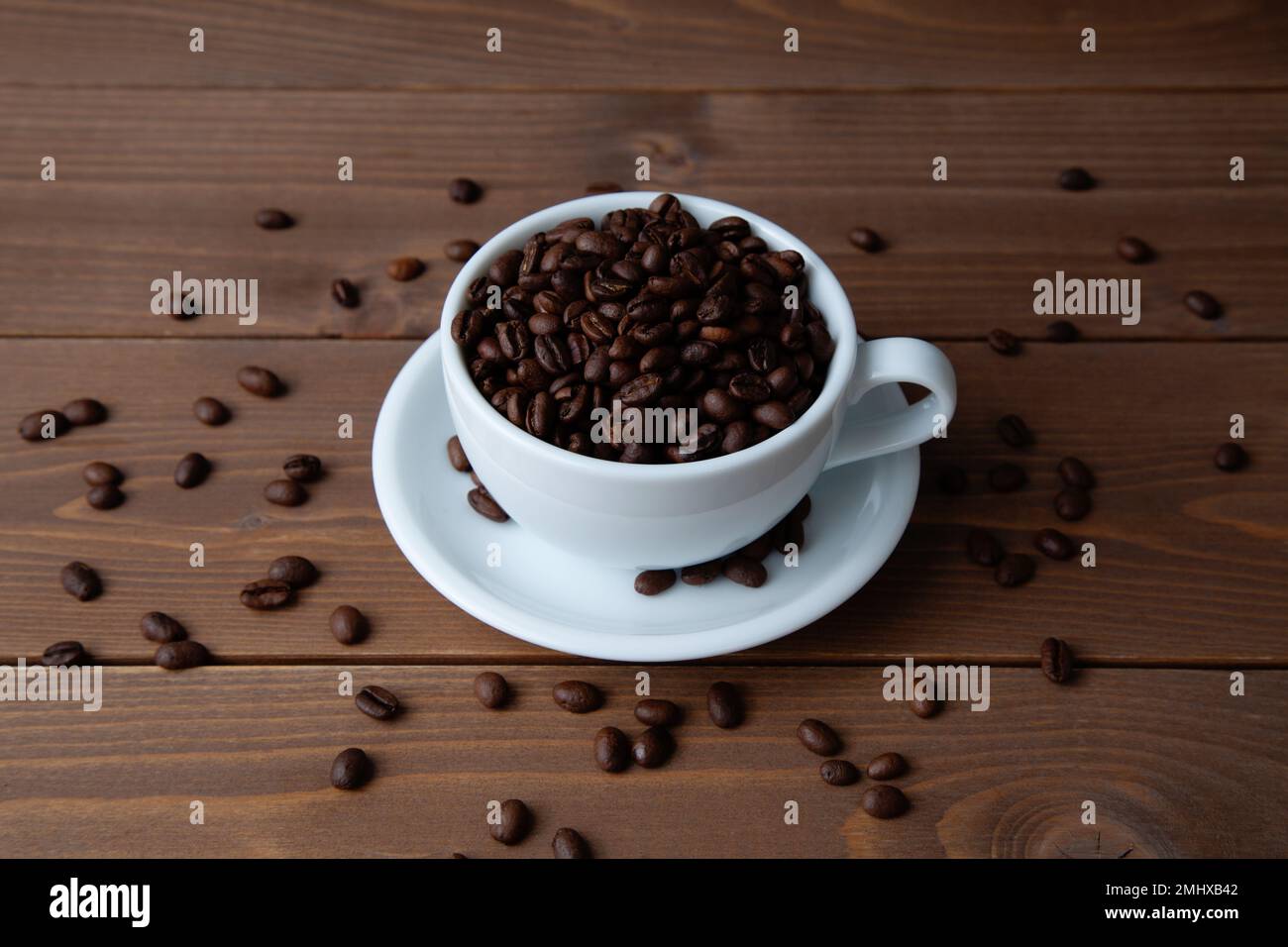 roasted coffee beans in coffee cup on table Stock Photo