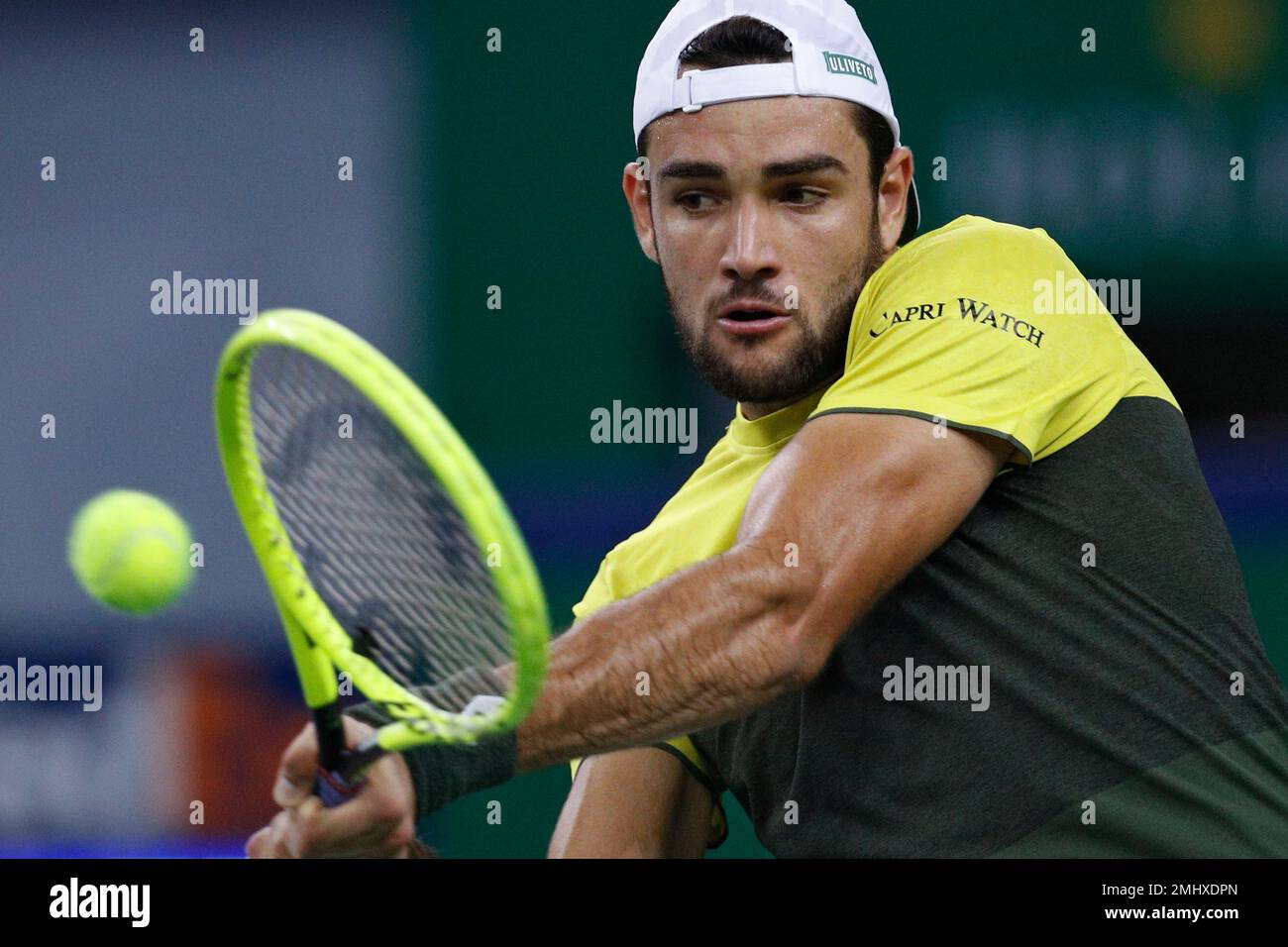 Matteo Berrettini of Italy hits a return shot against Dominic Thiem of Austria in the mens singles quarterfinals match at the Shanghai Masters tennis tournament at Qizhong Forest Sports City Tennis Center