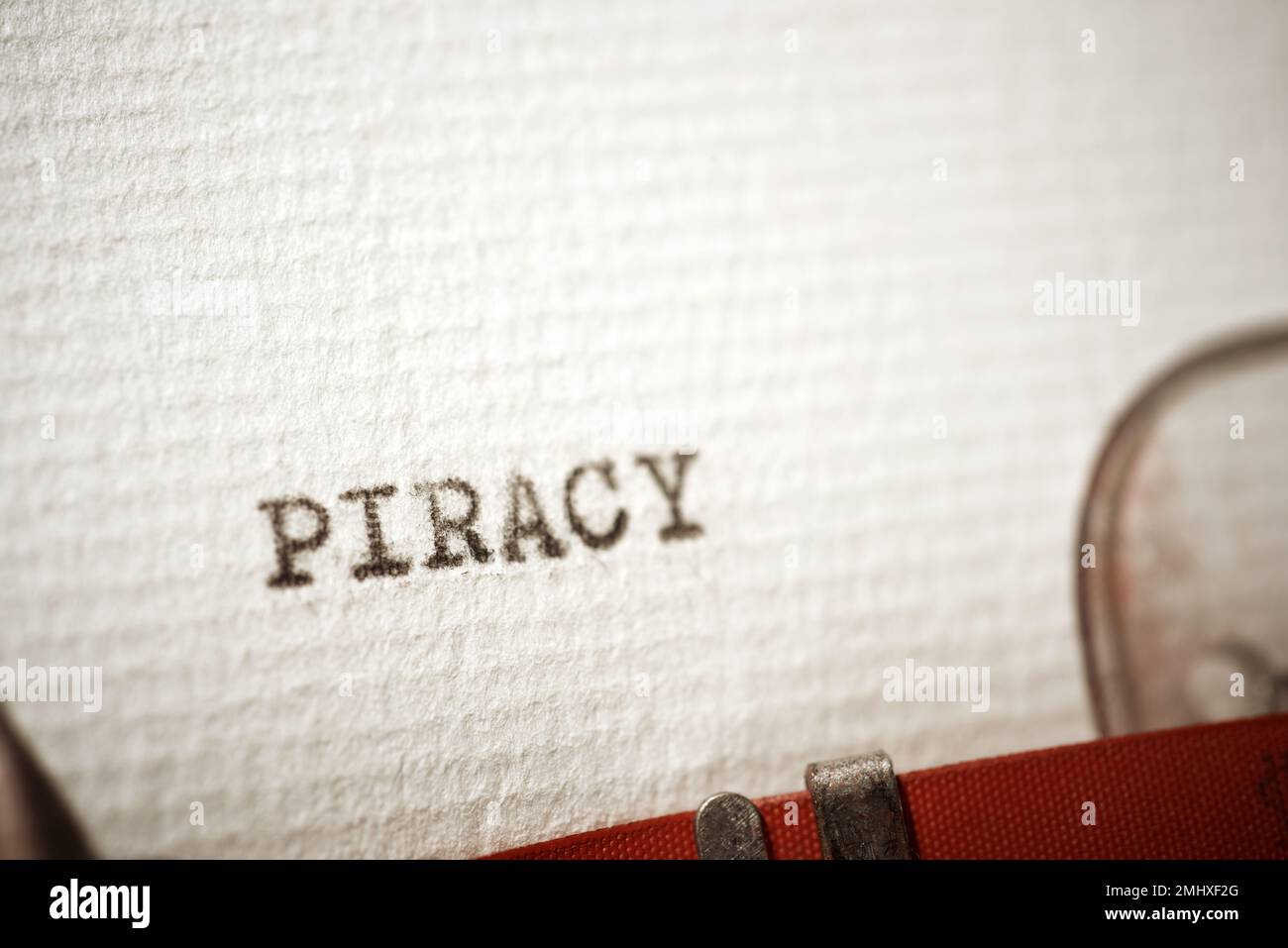 Piracy word written with a typewriter. Stock Photo