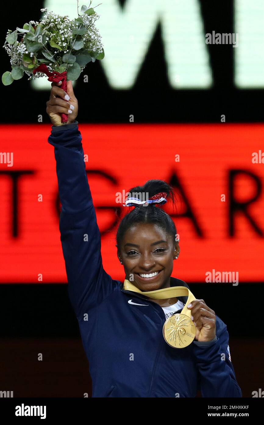 Gold medal winner Simone Biles of the U.S. celebrates on the podium