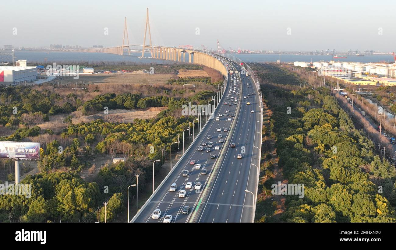 SUZHOU, CHINA - JANUARY 27, 2023 - Aerial photo taken on Jan. 27, 2023  shows a large number of vehicles passing the Sutong Bridge slowly on the  G15 highway from north to