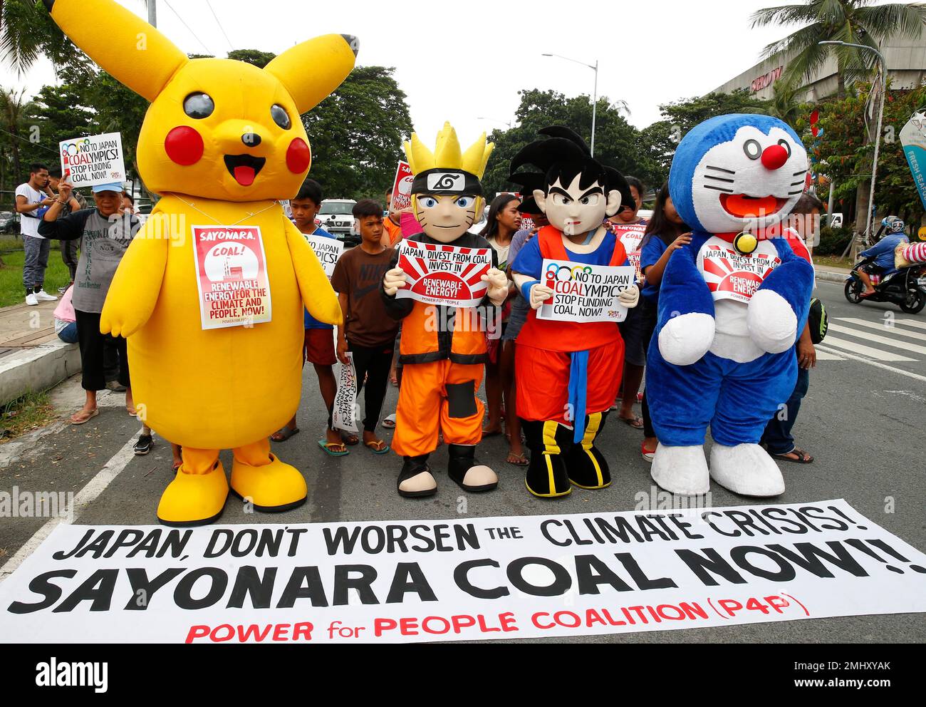 Environmental activists, dressed in anime costumes as, from left, Pikachu, Naruto, Goku and Doraemon, join other activists in a rally to call on Japanese government to stop funding coal especially to the ASEAN region, which they claim contributes to the worsening climate change globally Wednesday, Oct. 9, 2019 in suburban Pasay city, south of Manila, Philippines. The protest coincided with the ASEAN senior officials meeting on sports that was attended by Japan as it hosts the 2020 Olympics. (AP Photo/Bullit Marquez) Stock Photo