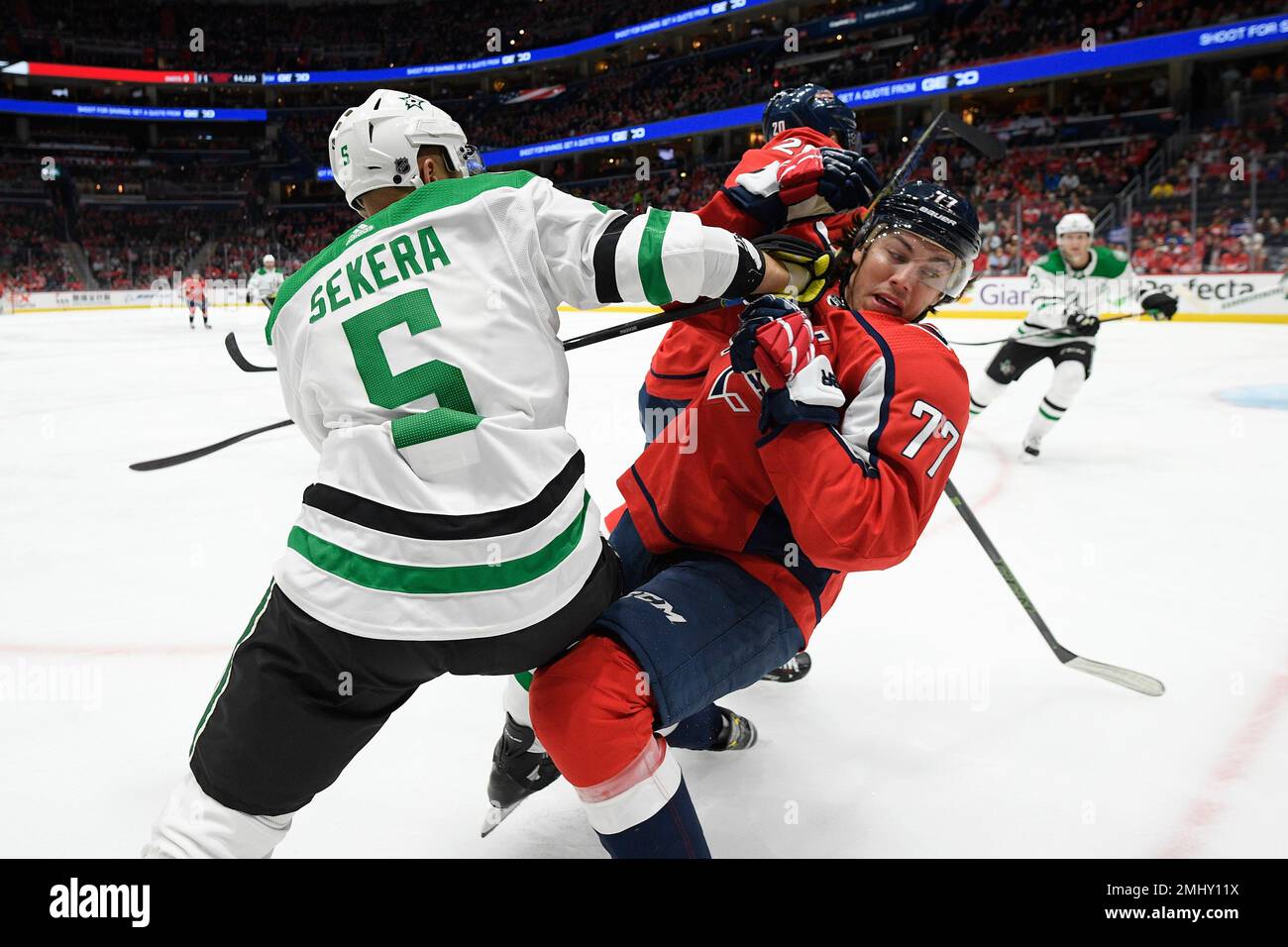 Dallas Stars defenseman Andrej Sekera (5), of Slovakia, battles with  Washington Capitals right wing T.J. Oshie (77) during the first period of  an NHL hockey game Tuesday, Oct. 8, 2019, in Washington. (