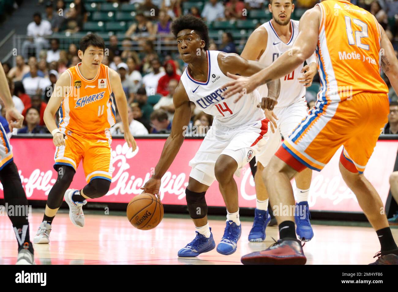 Los Angeles Clippers shooting guard Terance Mann (14) tries to get