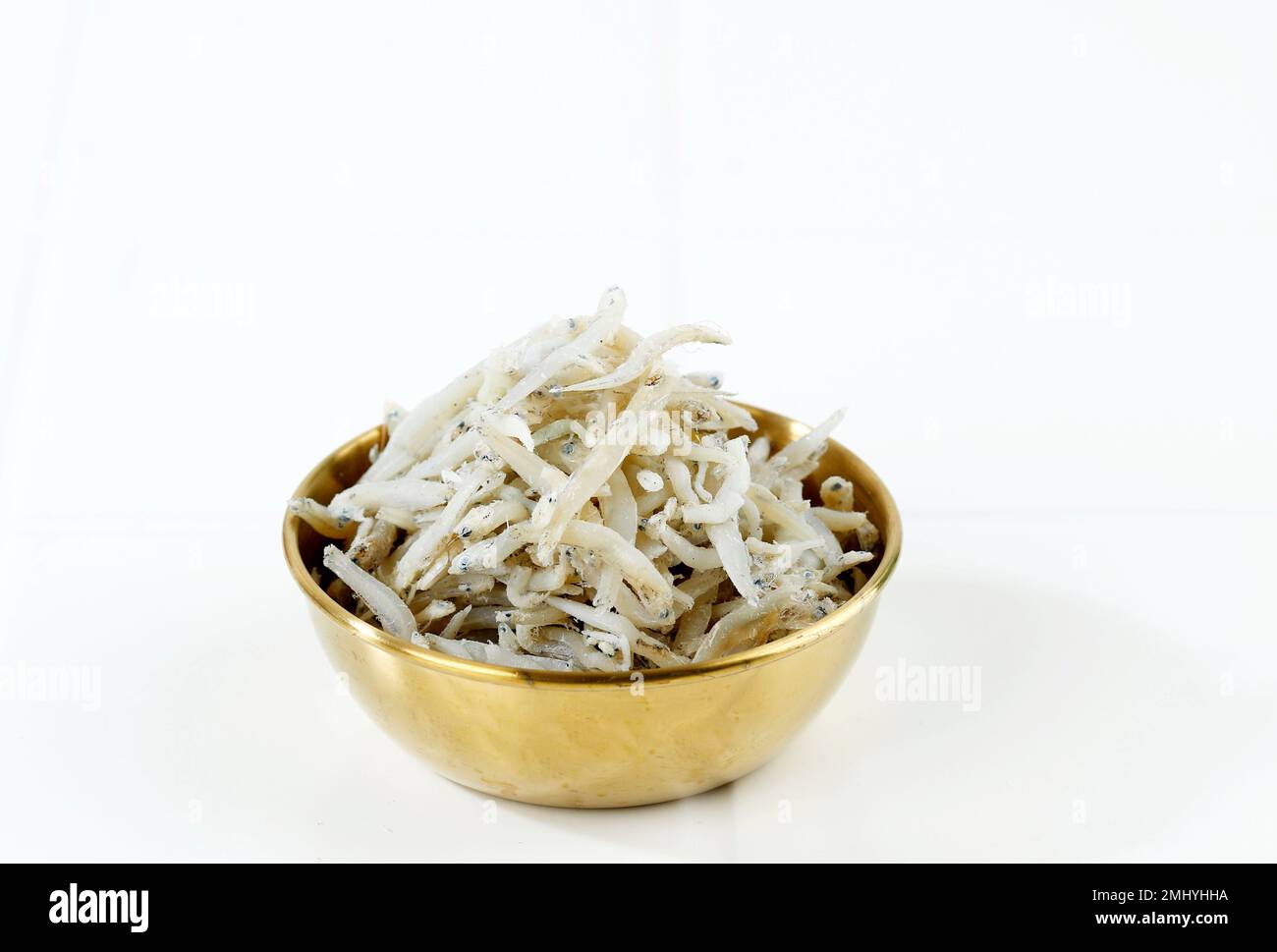 Fresh Dried Anchovies on White Background. Raw Dry Salted Sea Fish
