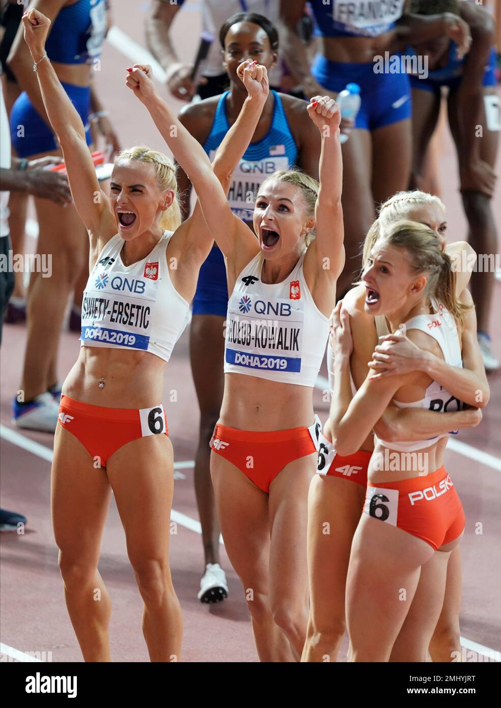 Silver medalists from Poland react after the the women's 4x400 meter