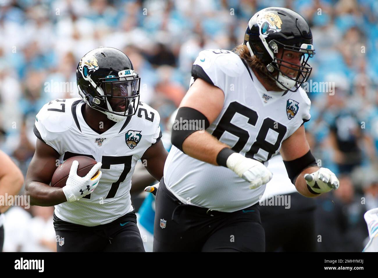 Jacksonville Jaguars running back Leonard (27) runs while