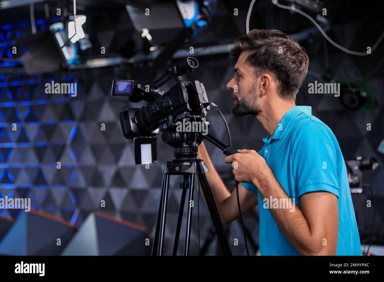 Professional video camera operator working in studio Stock Photo Alamy