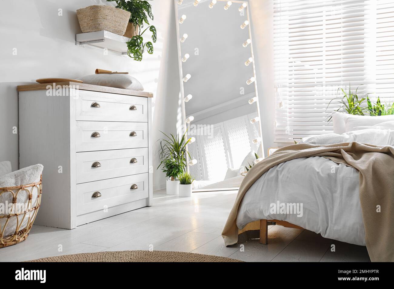 White chest of drawers in beautiful bedroom. Interior design Stock ...