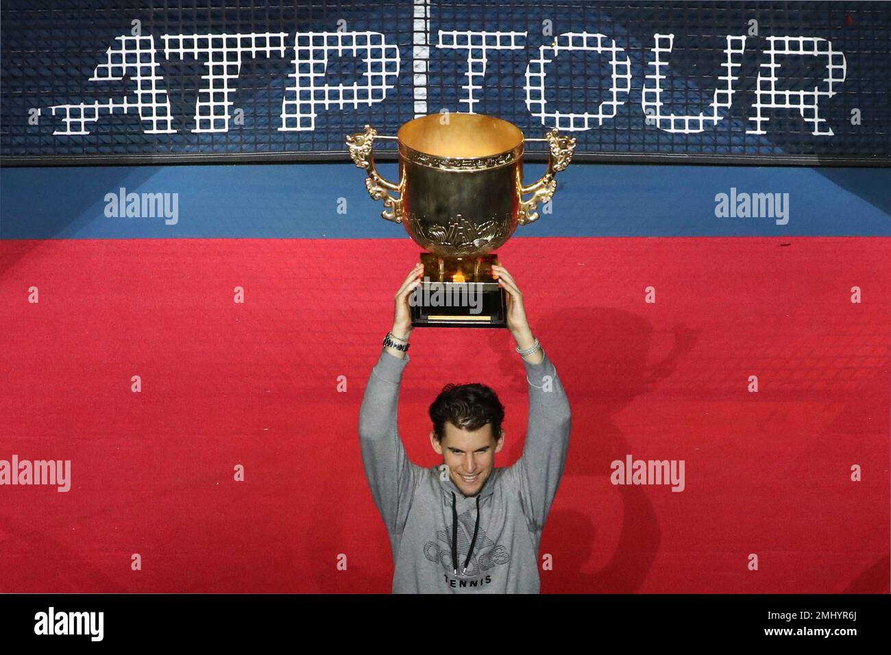 Dominic Thiem of Austria lifts-up the trophy after defeating Stefanos  Tsitsipas of Greece during the men's final at the China Open tennis  tournament in Beijing, Sunday, Oct. 6, 2019. (AP Photo/Ng Han