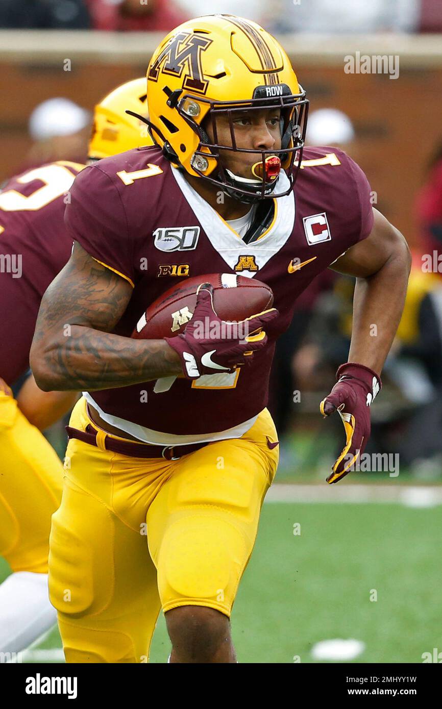 Minnesota running back Rodney Smith (1) rushes against Illinois in the