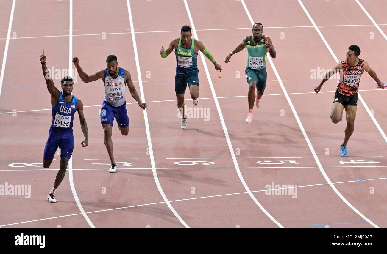 Noah Lyles of the United States crosses the finish line to win the men