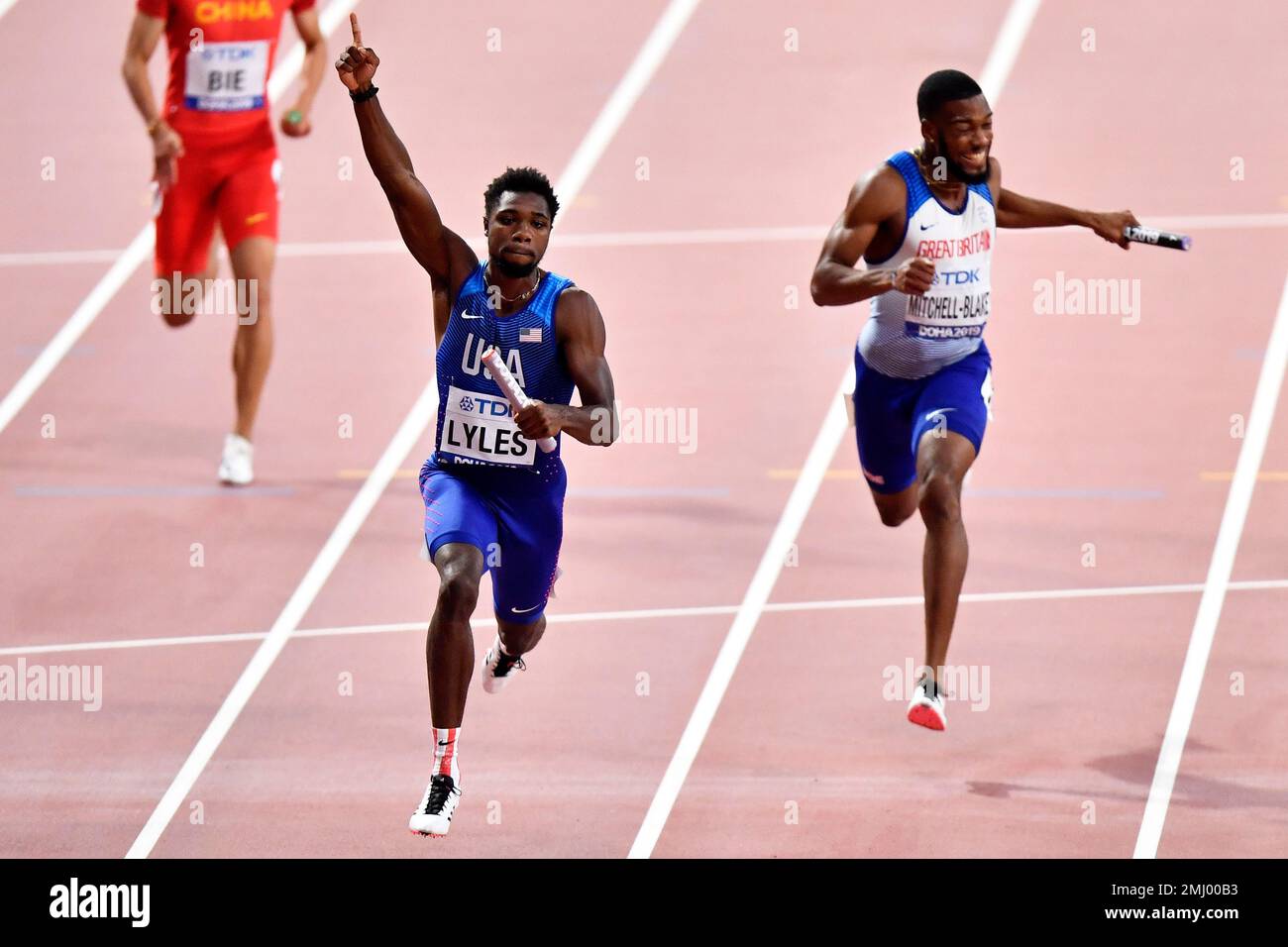 Noah Lyles of the United States crosses the finish line to win the men
