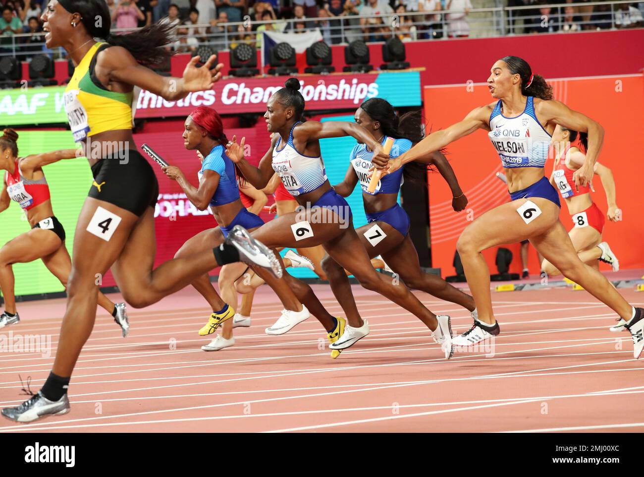 Great Britain and N. Ireland's Daryll Neita gets the baton from