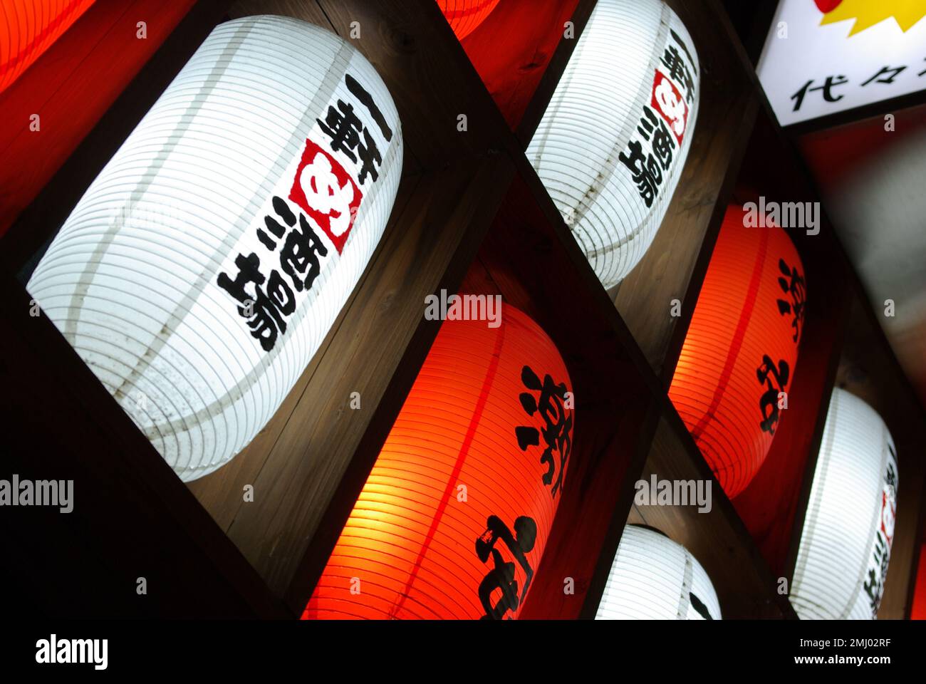 Red and white Japanese lanterns (chochin, chouchin) in front of a Japanese izakaya in Yoyogi, Tokyo area Stock Photo