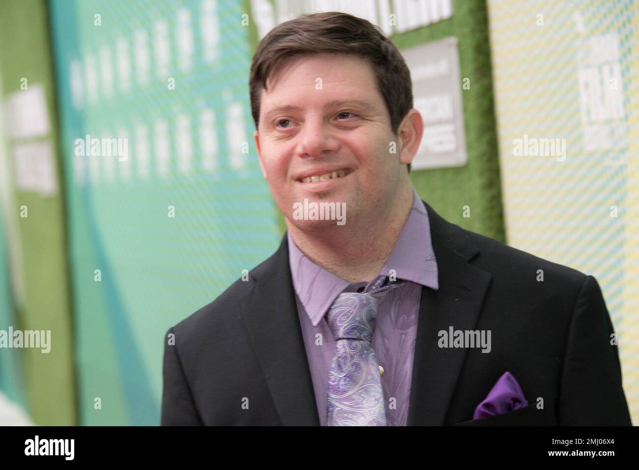 Zack Gottsagen poses for photographers upon arrival at the premiere of